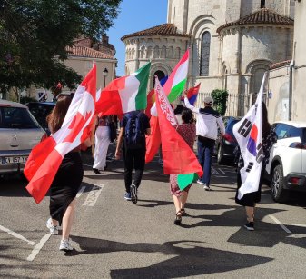 International people with flags in the street